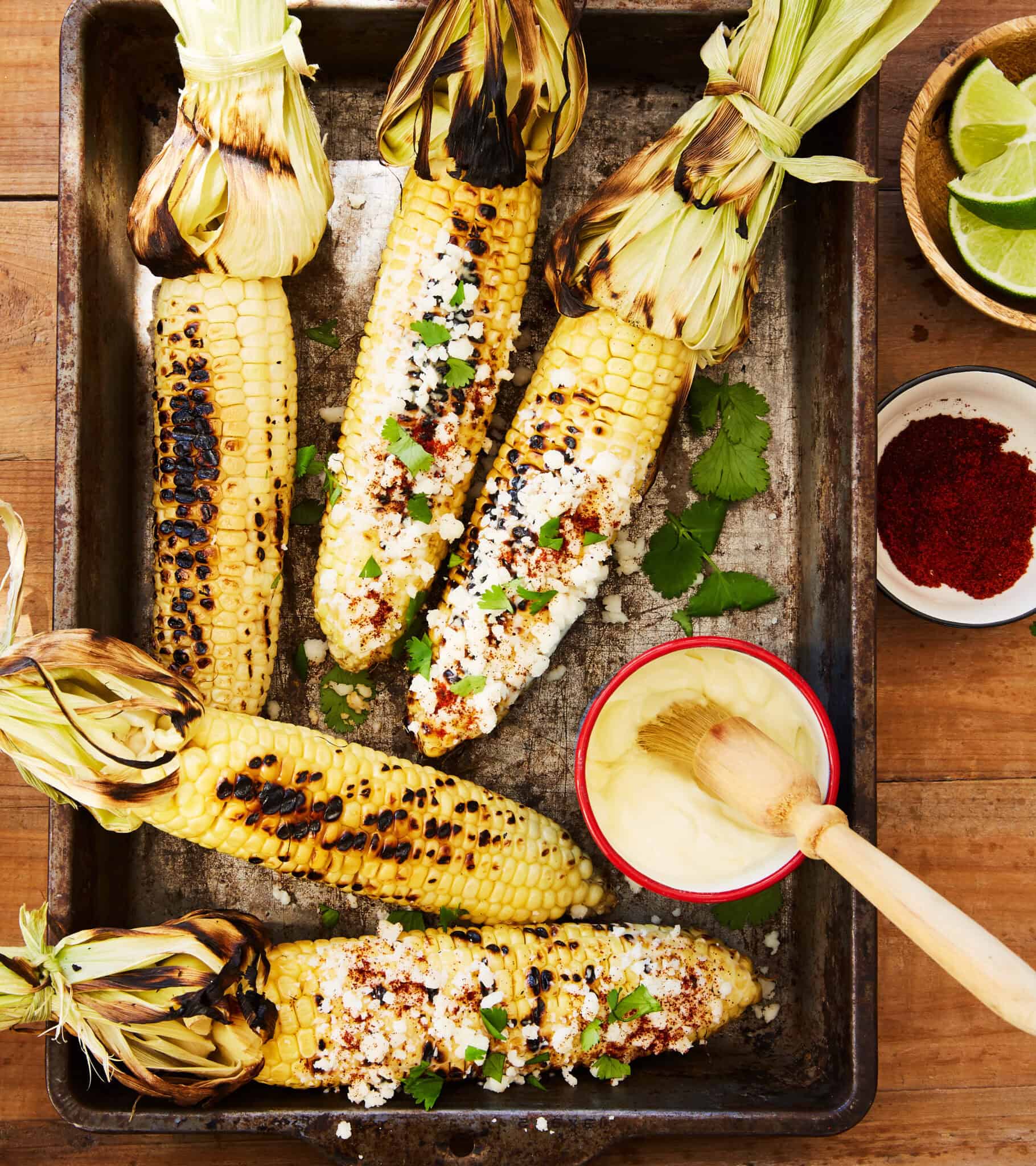 smoked street corn elote with cotija cheese chilli powder lime mayo creamy smoky charred BBQ showpiece