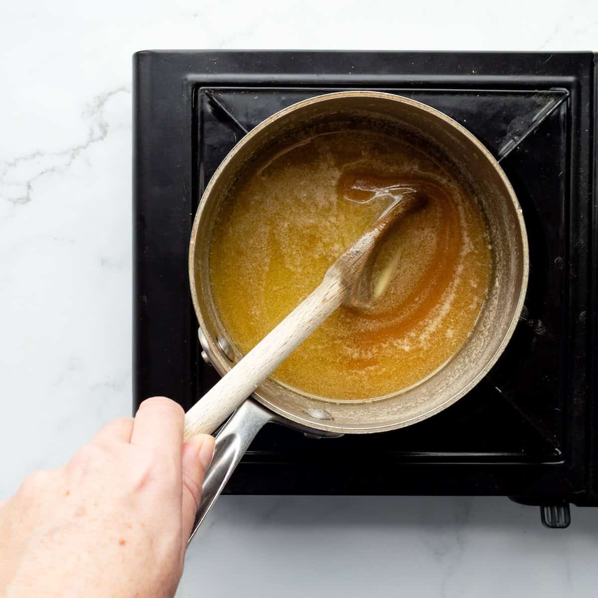 Making toffee in a small saucepan.