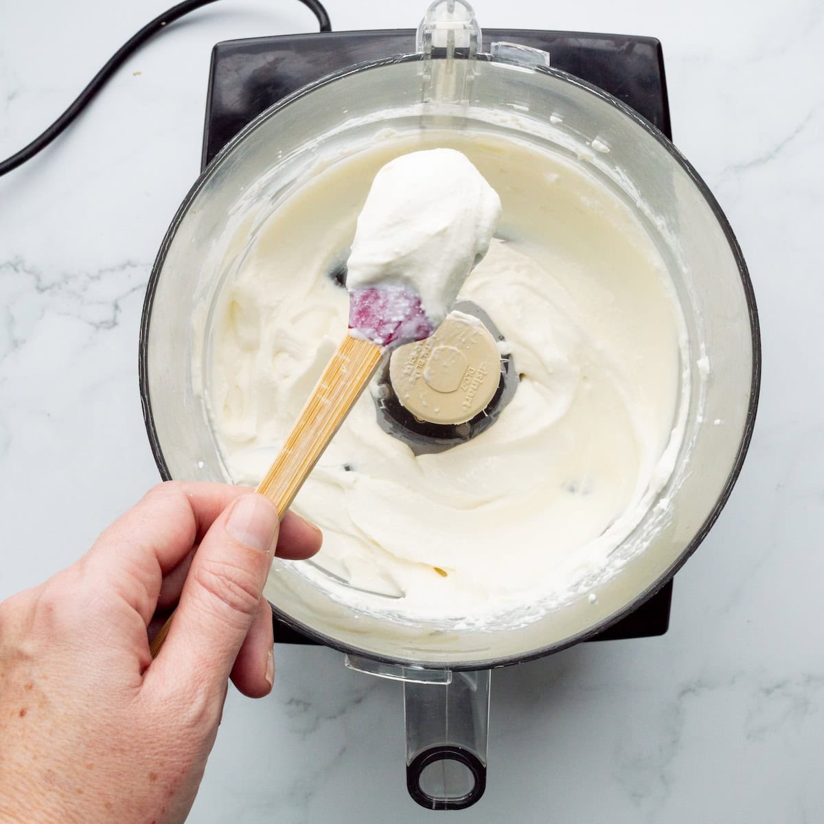 Processing cream cheese and cottage cheese in a food processor until creamy.