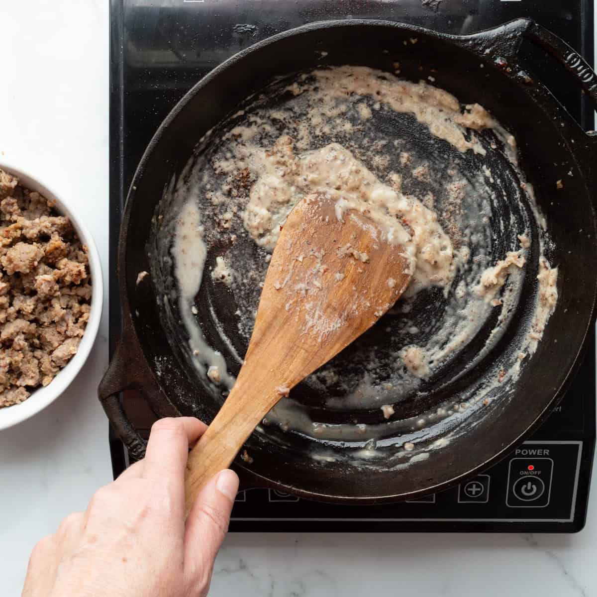 Cooking a roux in a cast-iron skillet.