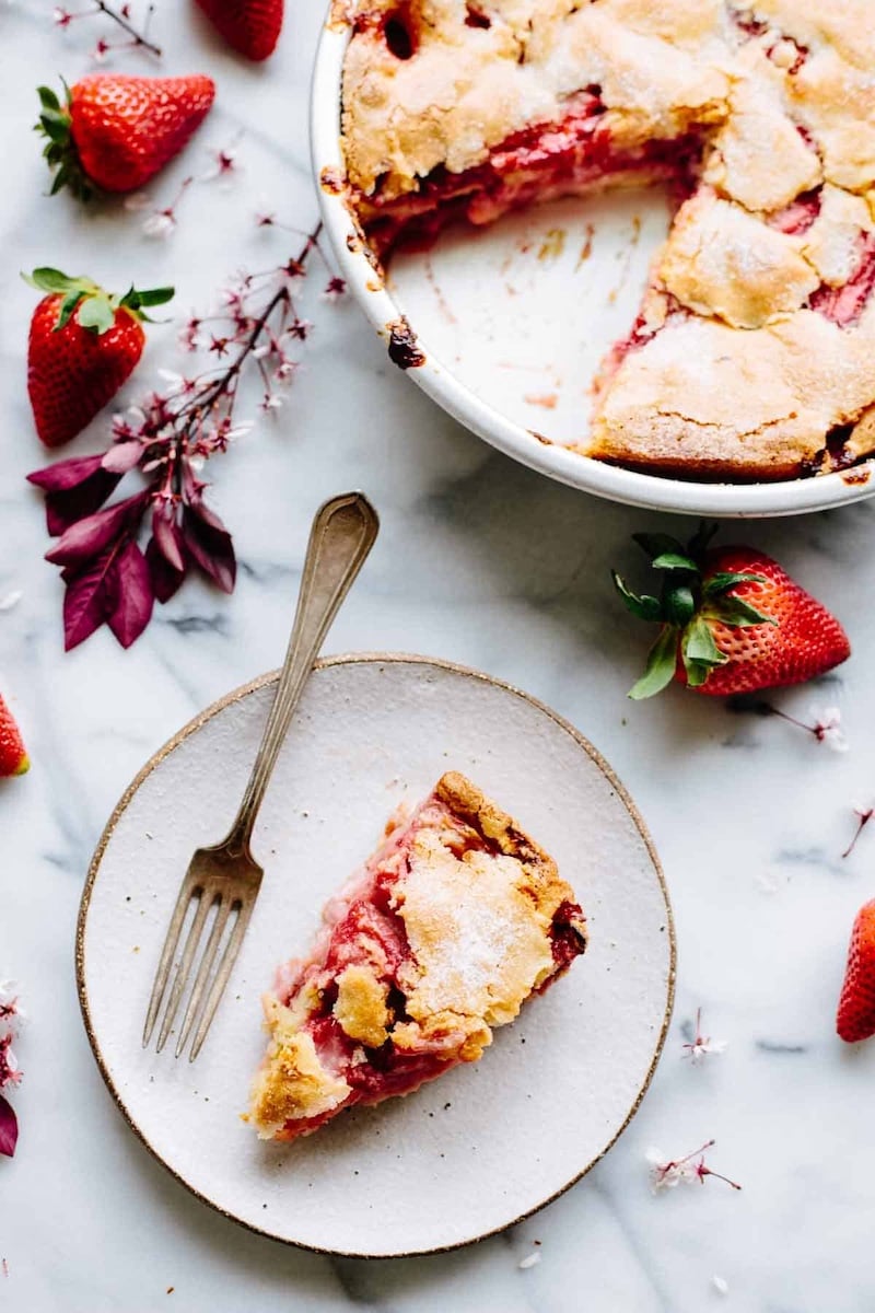 A slice of strawberry spoon cake on a plate.