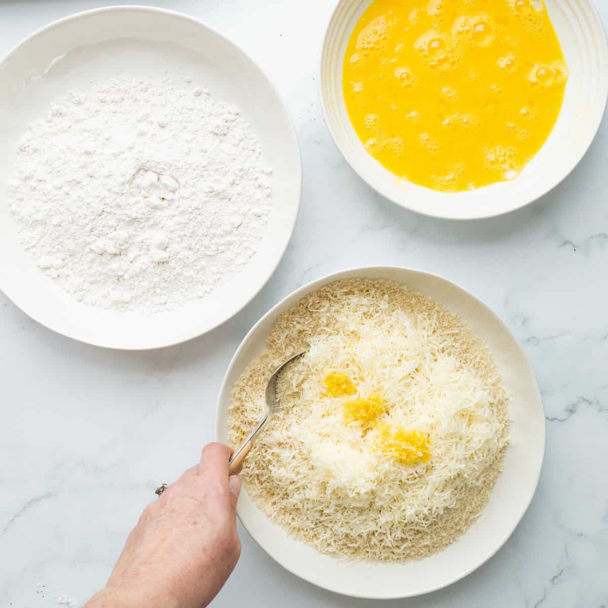 Creating a dredging station with flour, eggs, and a panko breadcrumb mixture.